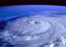 A breathtaking satellite image capturing a swirling hurricane over the Earth's ocean.